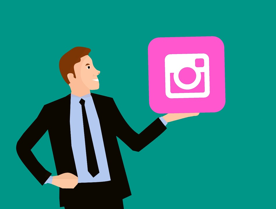 A man is holding the Instagram icon and lifting it up to showcase everyone